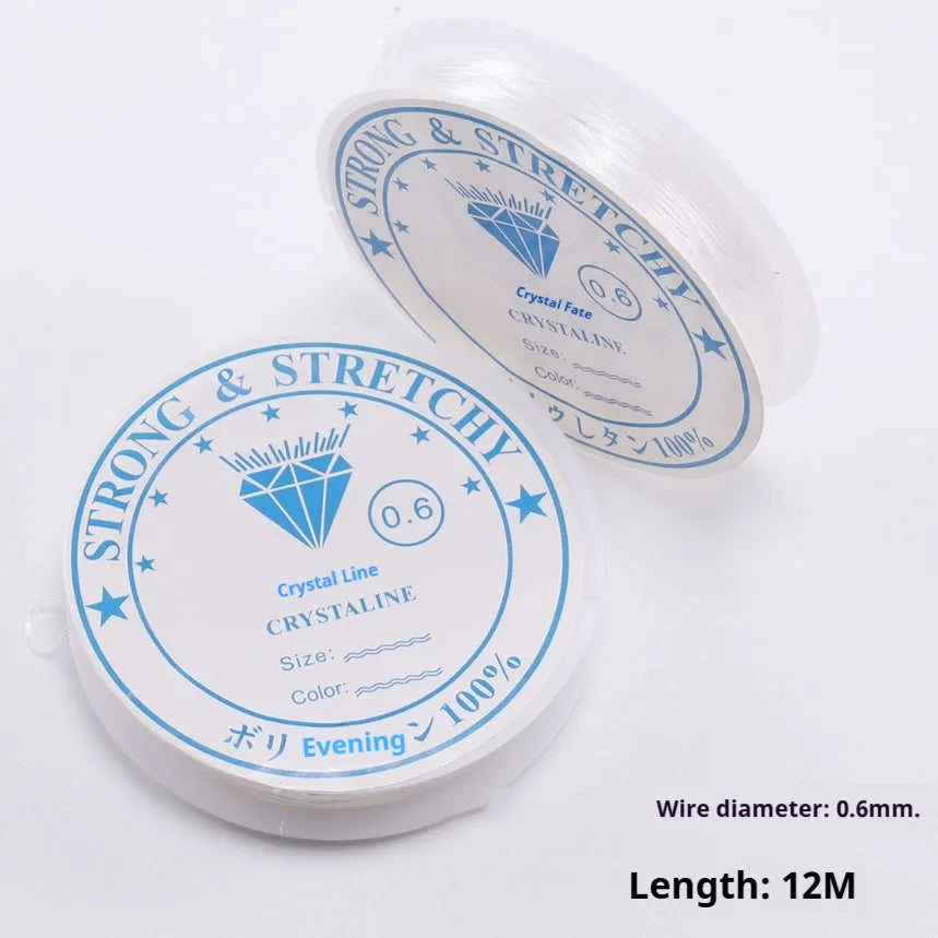 Transparent white elastic fishing line spool for DIY ornaments and craft projects