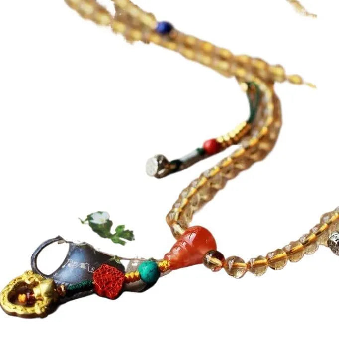 Natural citrine bracelet with red and yellow 1mm beads on filament string in light luxury style