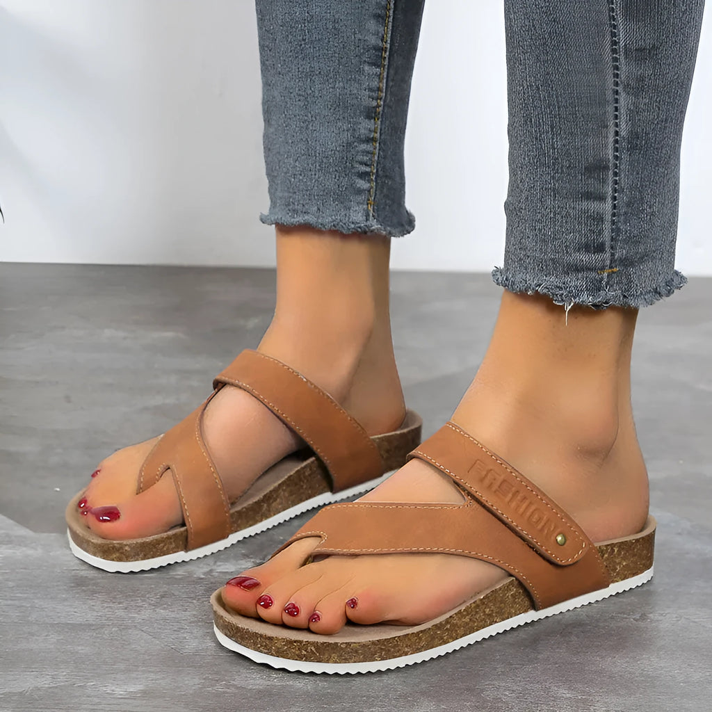 Flat toe ring flip-flops with thick foam sole in blue, shown from the side.