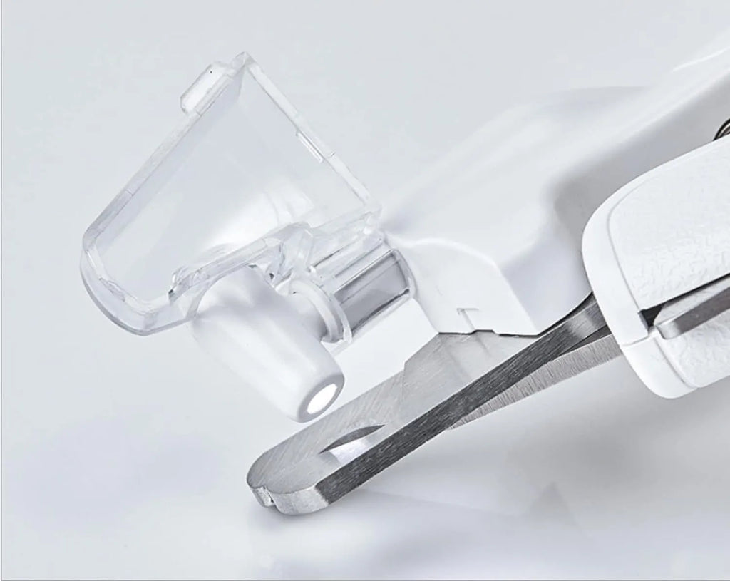 White pet nail clippers with LED light, triangular blade, and transparent anti-splash guard