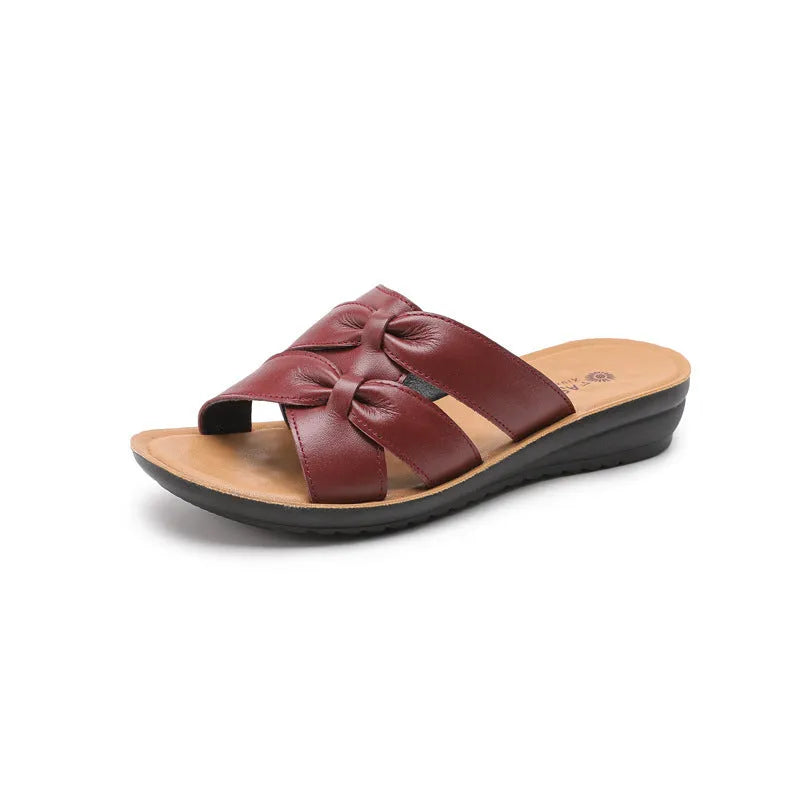 Women's cowhide leather soft bottom non-slip slippers in beige, black, and red colours on a light background