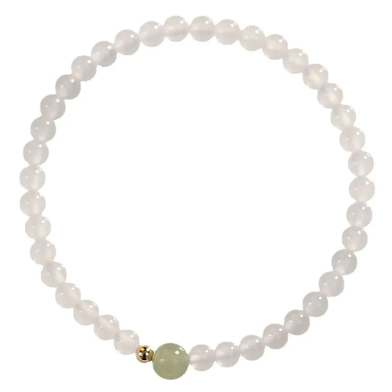 Natural Hetian Jade white agate women's bracelet 15cm on display showing banded white stones