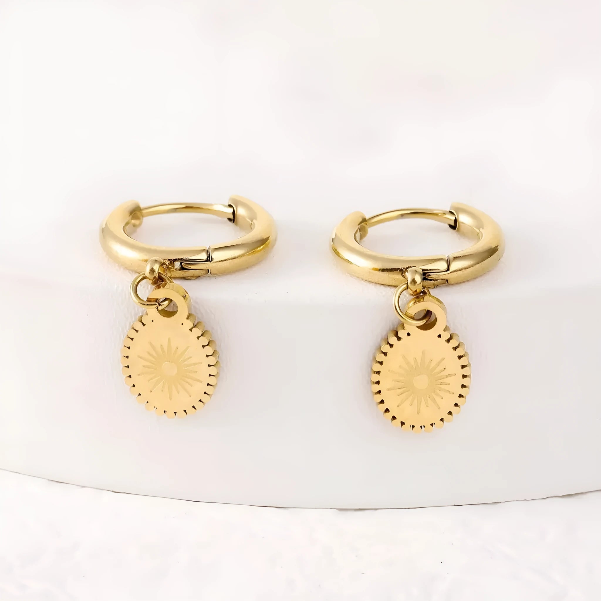 Women's stainless steel geometric earrings with oval drop design in metallic finish