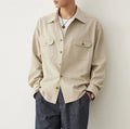 Men's cotton blend lapel shirt in light sand rice colour showing simple collar design and long sleeves