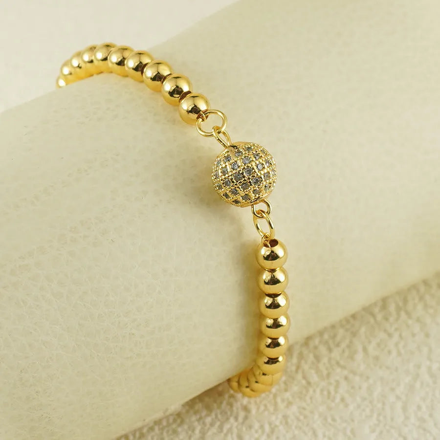 Women's electroplated copper bracelet with heart shape and round ball zircon in Arabic style design