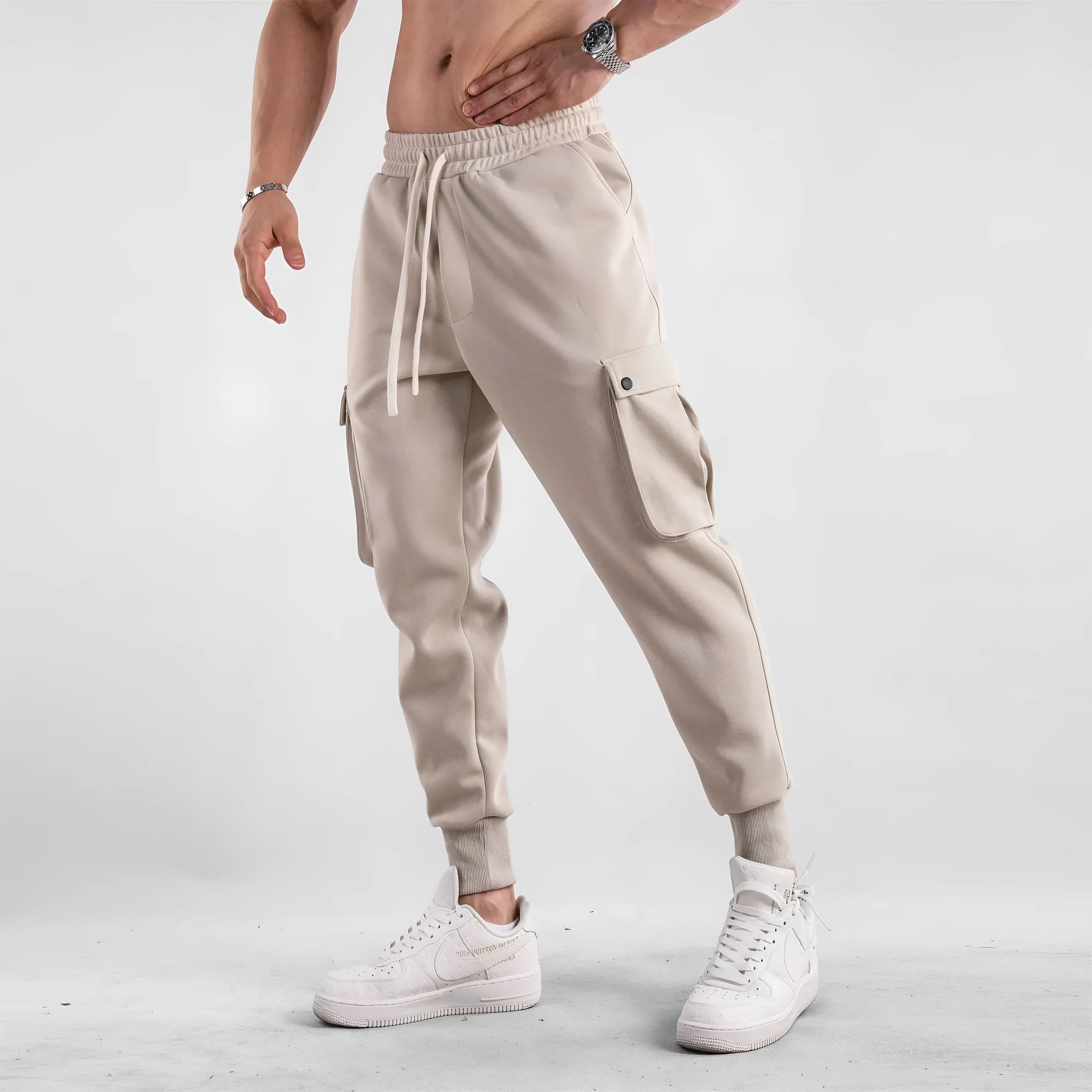 Men's loose cotton trousers with multiple pockets and adjustable ankle ties in solid colour options