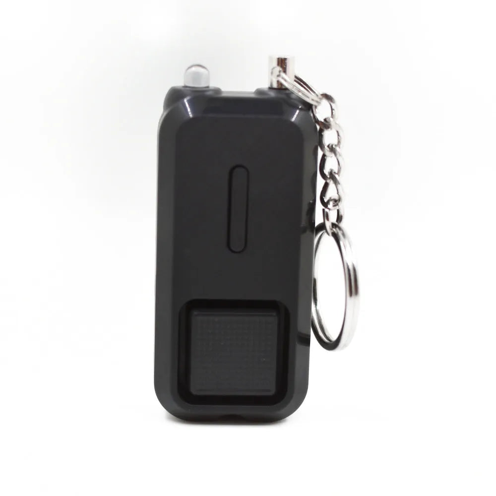 ZQ-202 personal safety alarm in pink, showing compact size and keychain attachment.