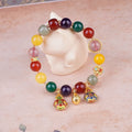 Swallowing Gold Beast agate crystal bracelet with 10mm beads, hand-woven, animal zodiac style on neutral background
