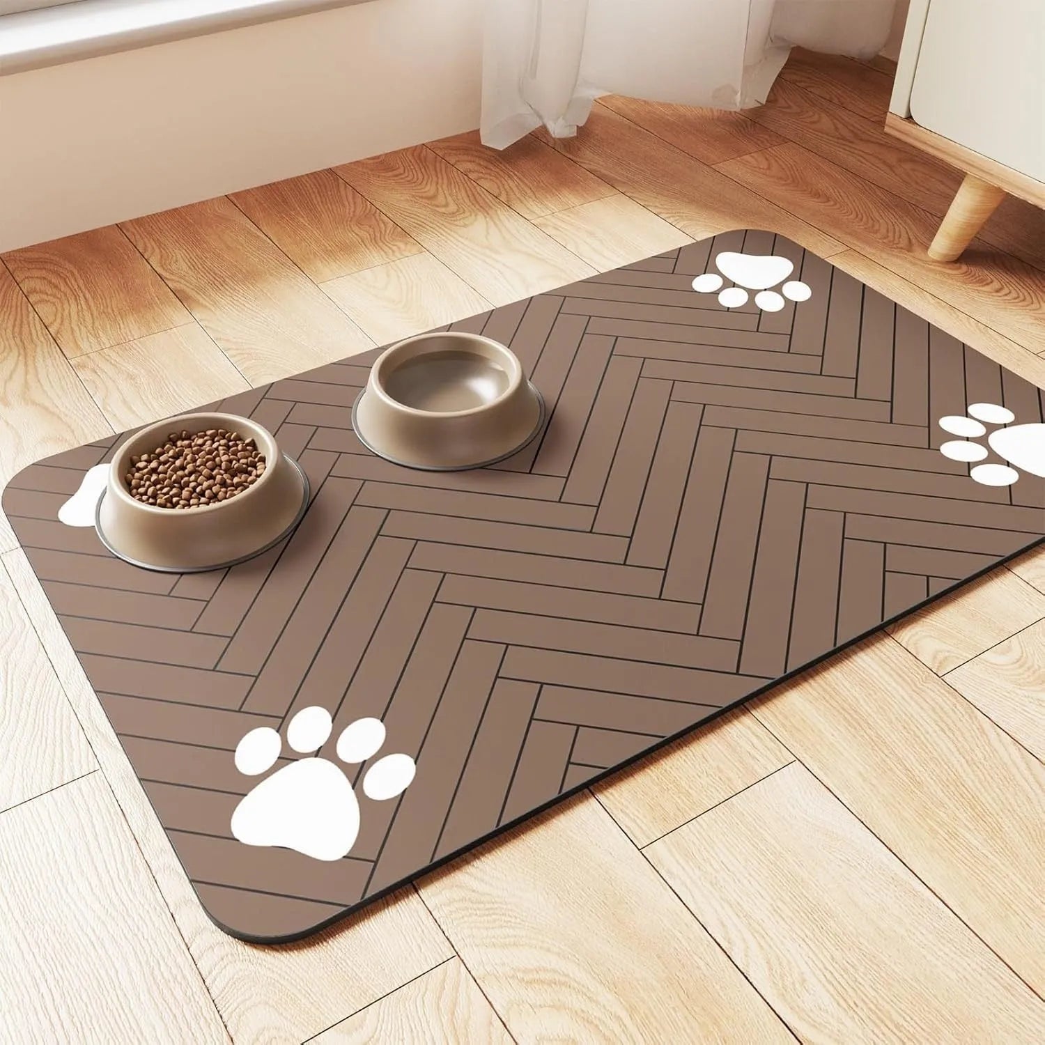 Diatom ooze pet feeding mat in gray, placed under cat water bowl on floor