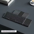 Black folding Bluetooth keyboard for mobile phones and tablets showing compact folded size