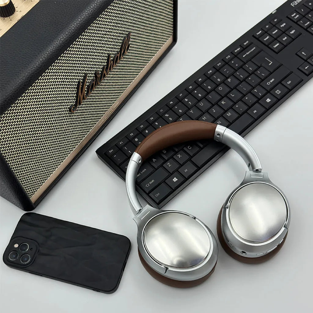 Retro wireless Bluetooth headset in vintage brown with metal ear cups and padded headband