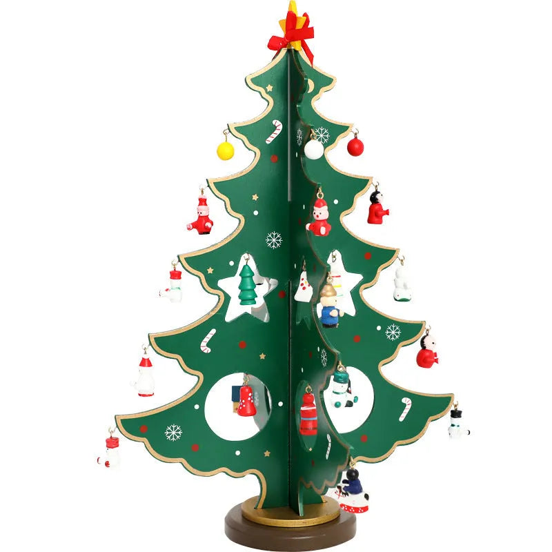 Set of three hand painted wooden Christmas trees in green on a table, largest 36cm tall