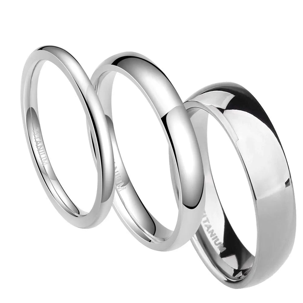 Silver titanium steel unisex ring on a finger, showing minimalist band in 2mm, 4mm, and 6mm width options.