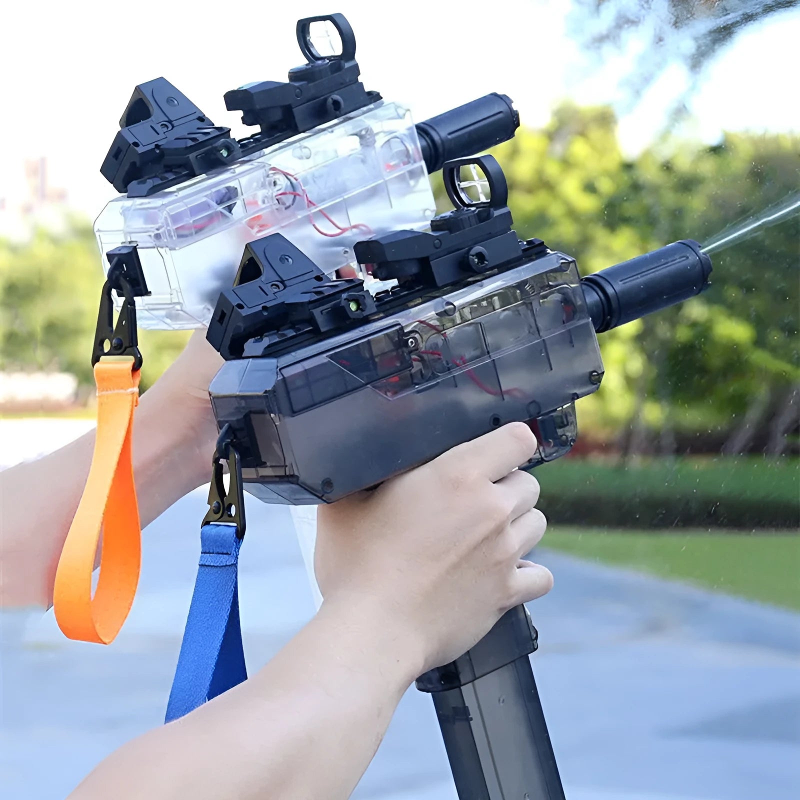 Electric water gun with transparent body and rechargeable battery held in hand, showing blue colour option