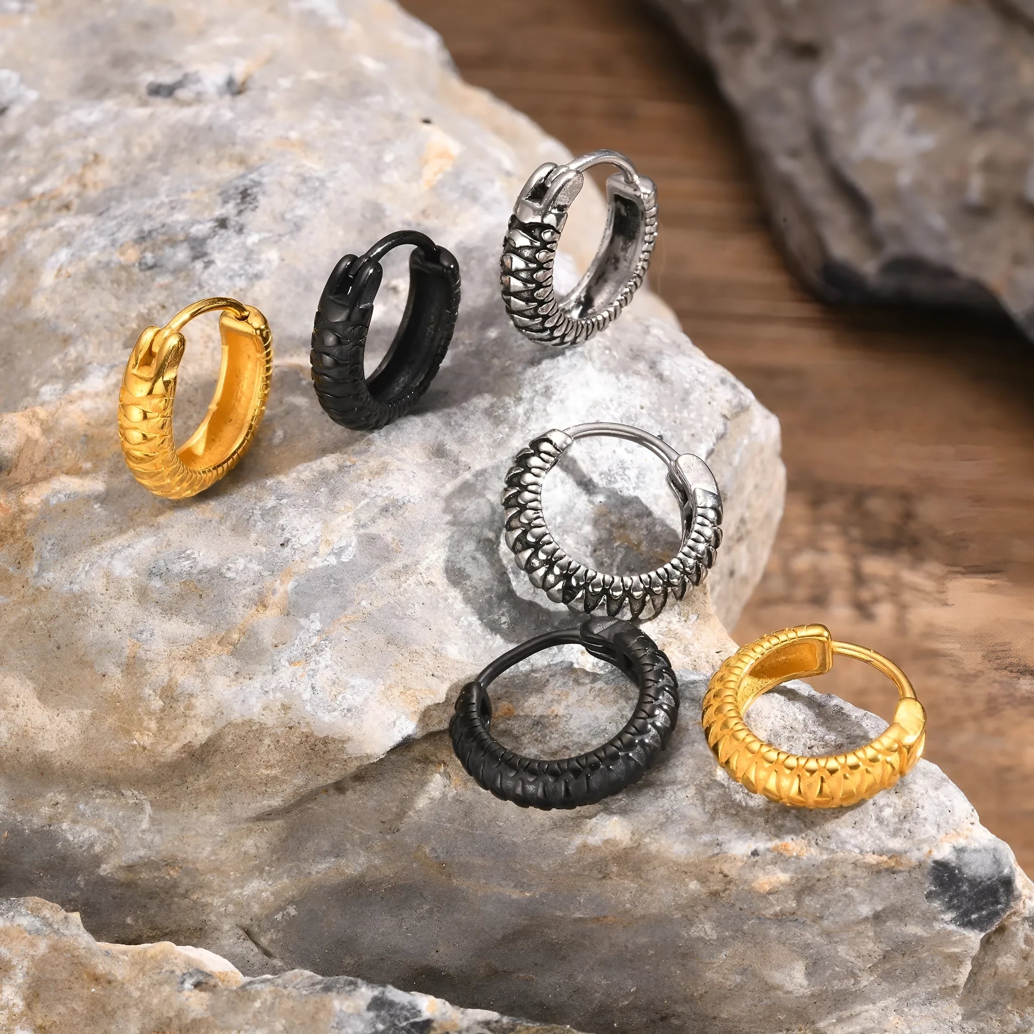 Stainless steel snake pattern earrings in black and gold finish, 30mm diameter