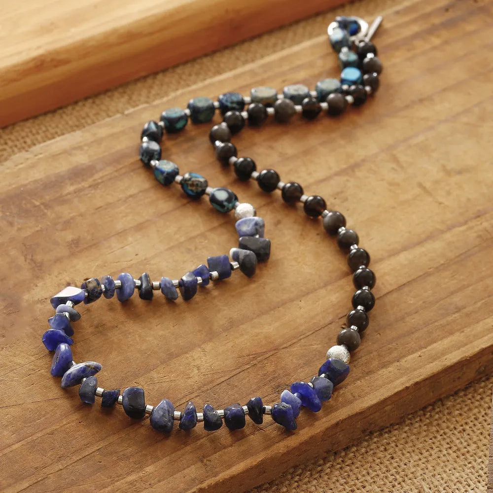 Blue multi-layer hand woven bracelet with Fang Hui stone and gold obsidian geometric texture on white background
