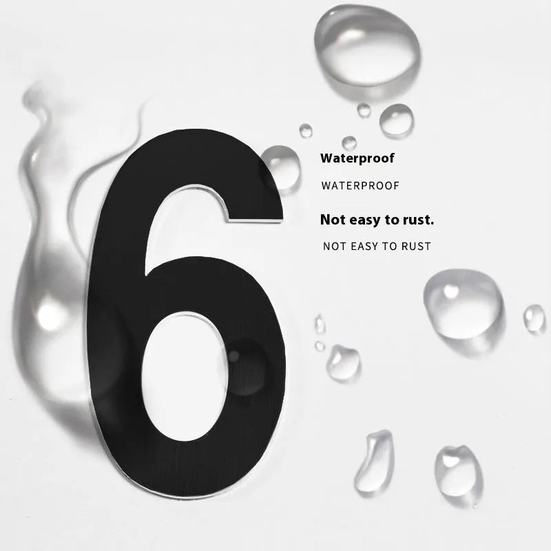 Black stainless steel adhesive house number plaque with a 7.5cm character size for outdoor use