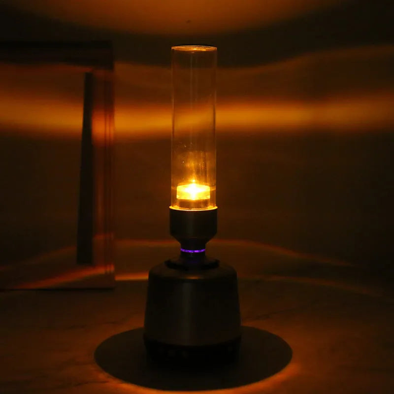 White silver cylindrical Bluetooth speaker with candlelight night light measuring 277mm tall