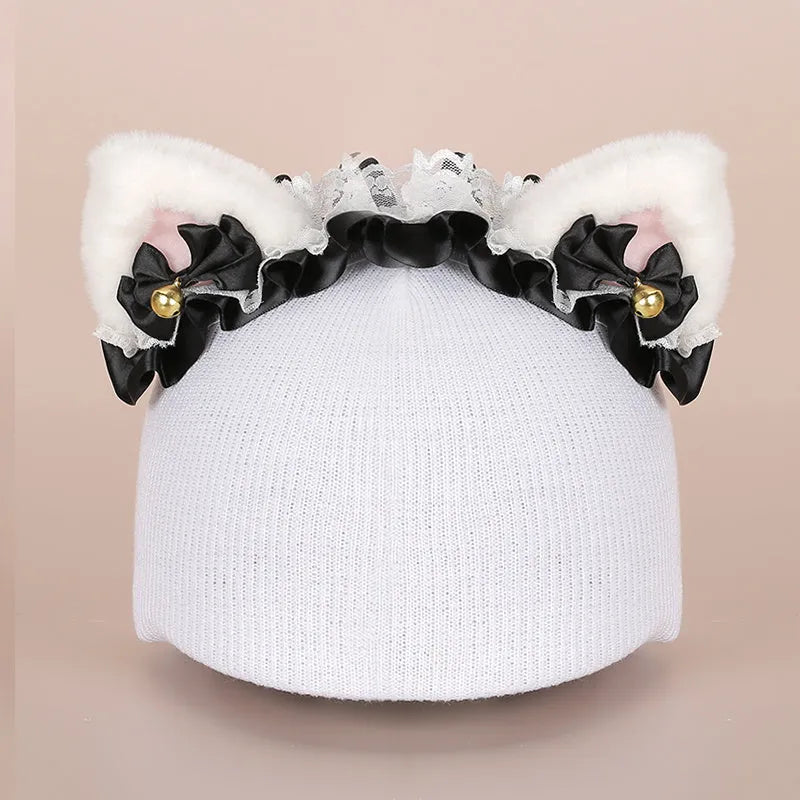 Plush cartoon hat decoration designed to attach to a ski helmet for personalisation