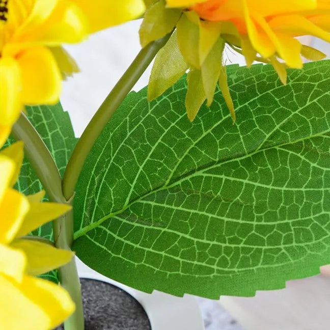 Rechargeable sunflower LED simulation night light with warm glow on a table