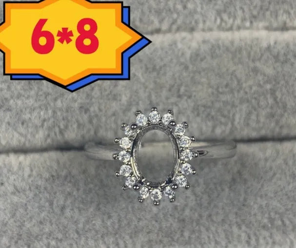 Oval denier copper ring with 6x8mm stone and star design on an open mouth band.