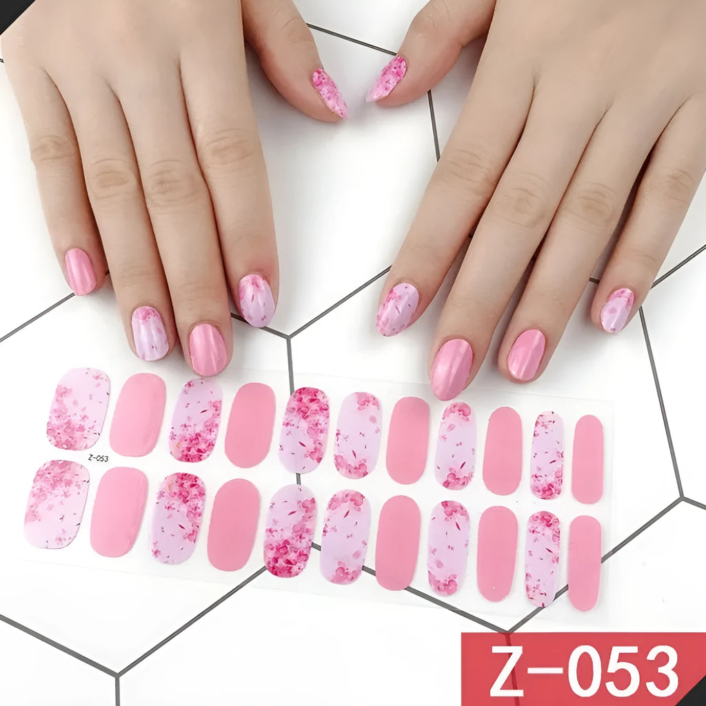 Korean nail stickers set with 22 pieces including cartoon, strawberry, flower, shell, and bow designs, plus a nail file.