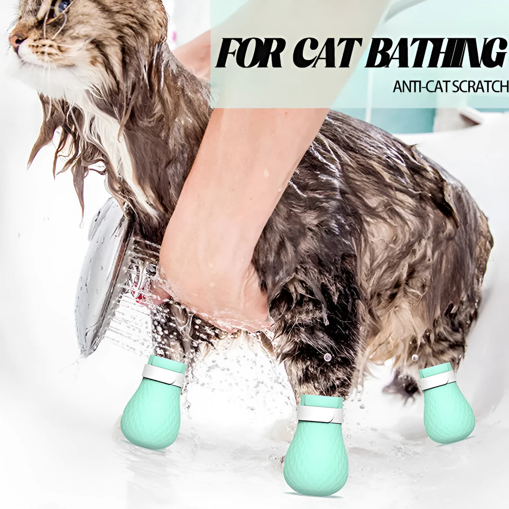 Four green silicone cat paw covers designed to prevent scratching and assist with pet handling