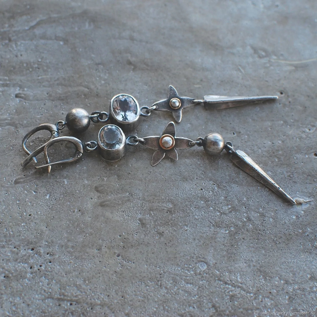 Geometric XINGX pendant earrings with antique silver plating and rhinestone details