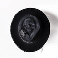 Handmade wool felt skull hat with conical crown showing Halloween design