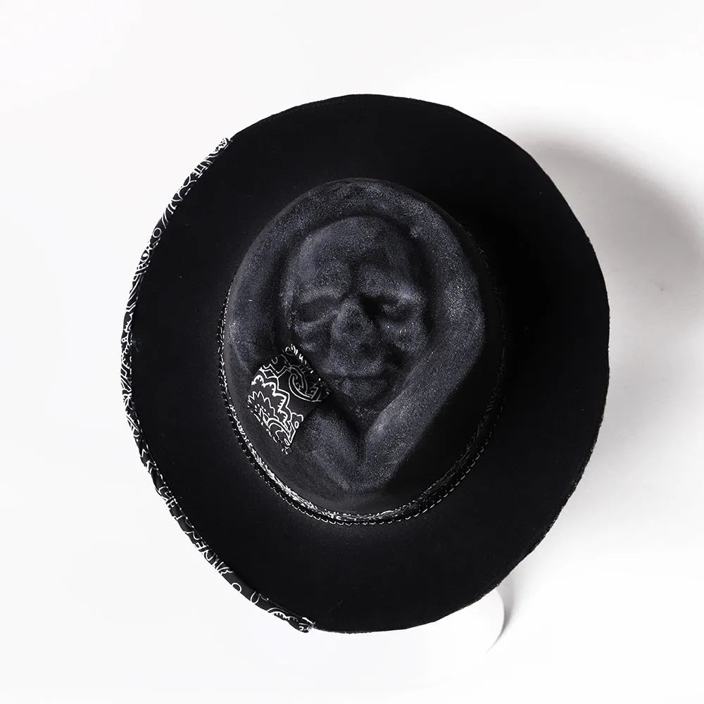 Handmade wool felt skull hat with conical crown showing Halloween design