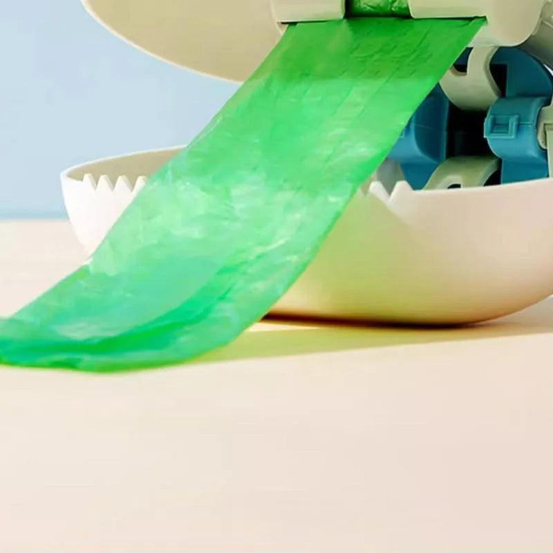 Pet dog pooper scooper with cloud shape jaw in blue colour on grass