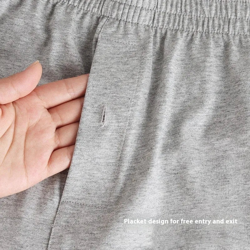 Men's light grey cotton boxer shorts with high waist and loose fitting design