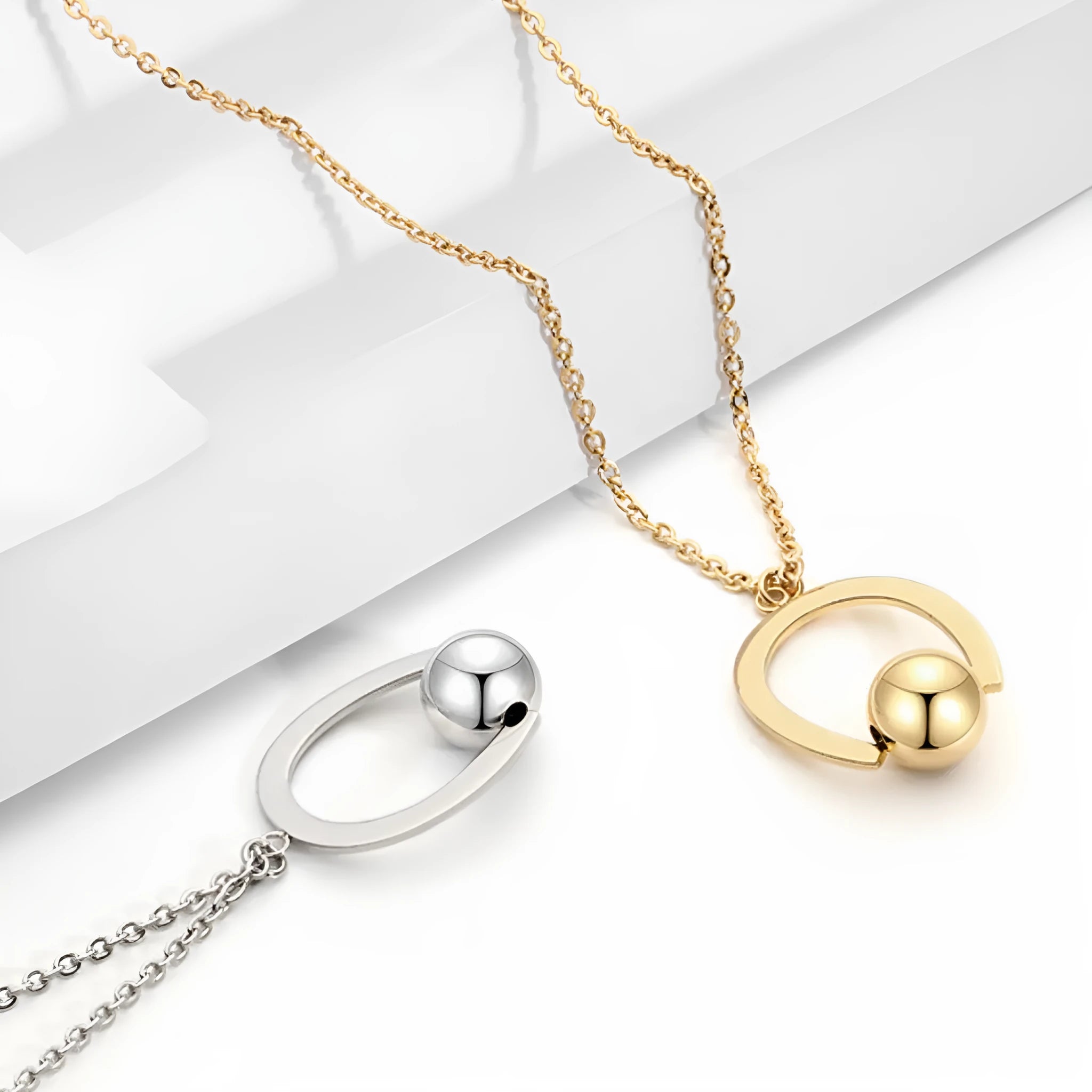Stainless steel geometry pendant necklace with adjustable bead chain in gold or silver electroplated finish