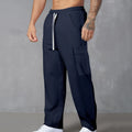 Men's loose-fitting corduroy cargo trousers in navy blue with a drawstring waist and wide straight legs