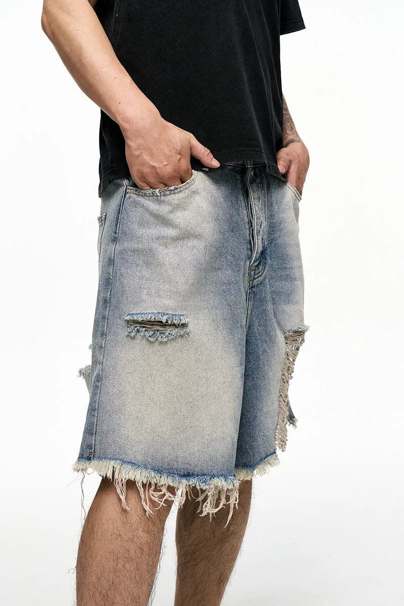 Men's light blue retro washed baggy denim shorts with wide leg cut and zipper fly