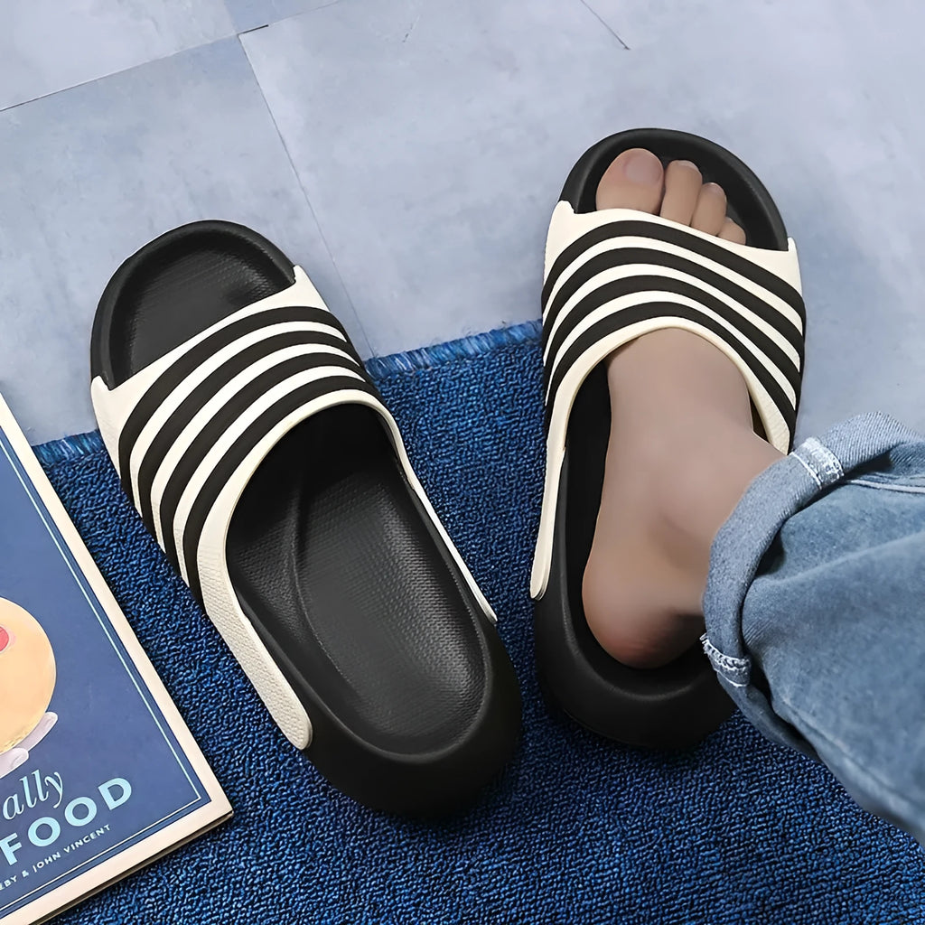 A pair of unisex casual slippers with a PVC upper and EVA sole, shown in a choice of colours.