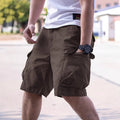 Men's army green cotton blend retro workwear shorts with a loose fit on a summer day.