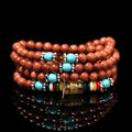 Golden star stone and nugget sand multi-circle bracelet with fu character on a retro-style chain.