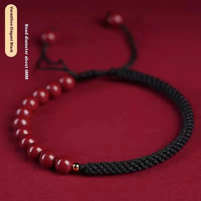 Braided rope bracelet with cinnabar beads in 8mm diameter and wine red colour