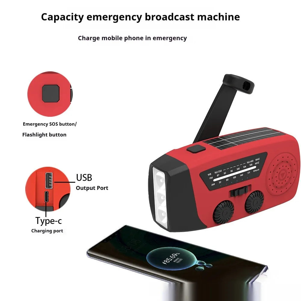 Red rechargeable hand radio emergency torch with ABS body, USB port, and wrist strap on plain background