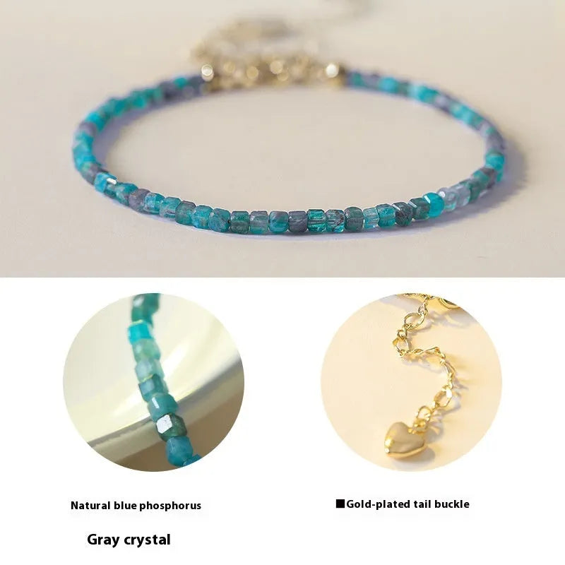 Natural blue apatite crystal bracelet with diamond-shaped beads, blue and grey colour, on a white background