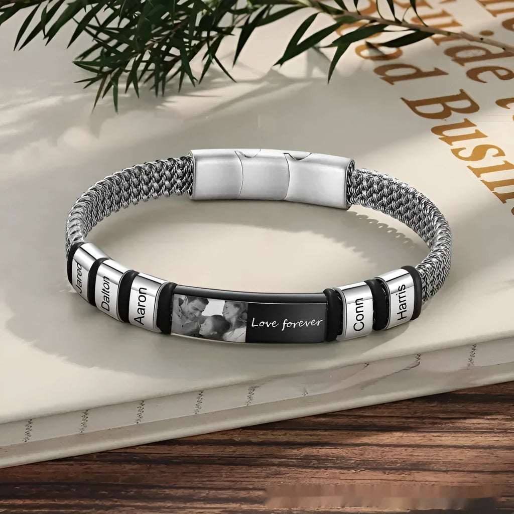Men's stainless steel bracelet with leather rope band and lettering beads showing heart-shaped pendant