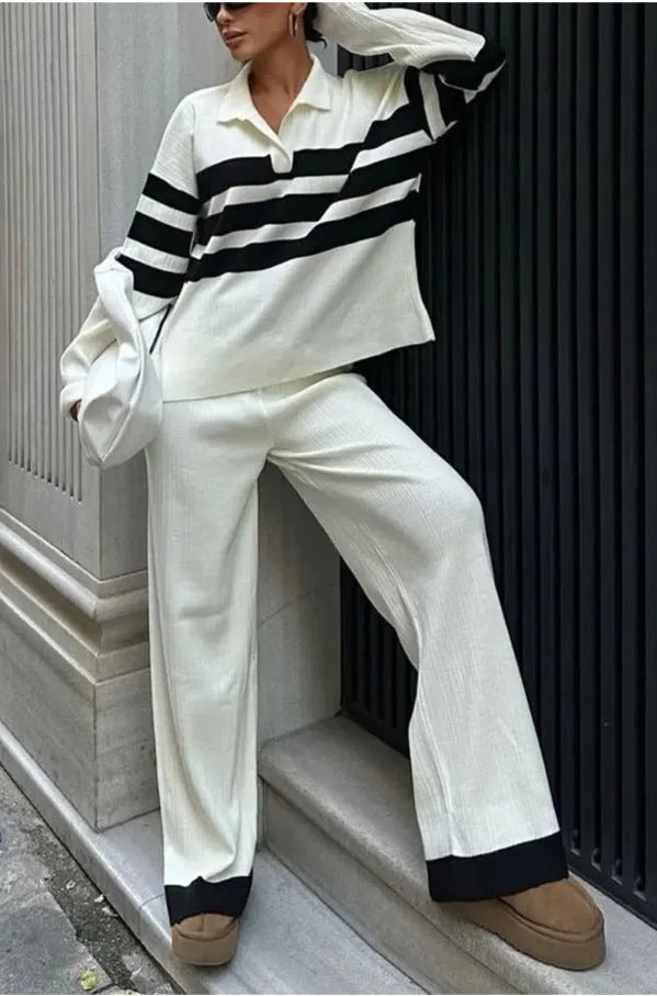 Women's black and white striped two-piece set with polo collar shirt and trousers