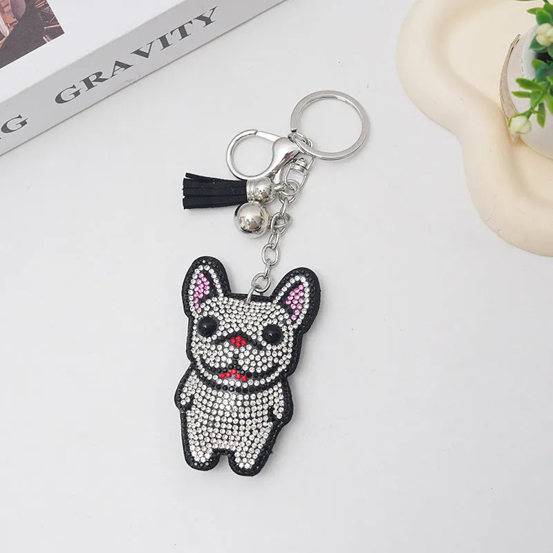 Cartoon French dog rhinestone keychain in alloy with electroplated finish.