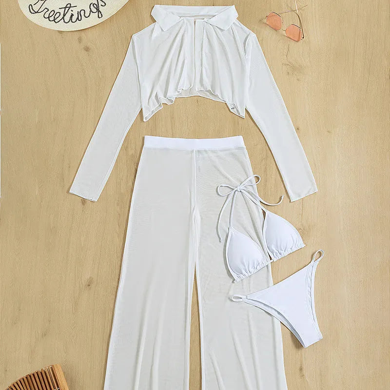 Women's white four-piece swimsuit set with high waist bottoms and backless top on a beach background