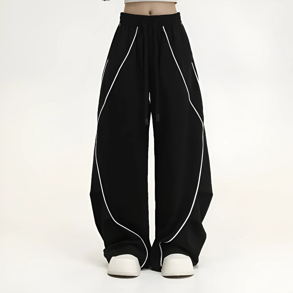 Black pleated wide-leg hip hop sports trousers with a striped pattern.