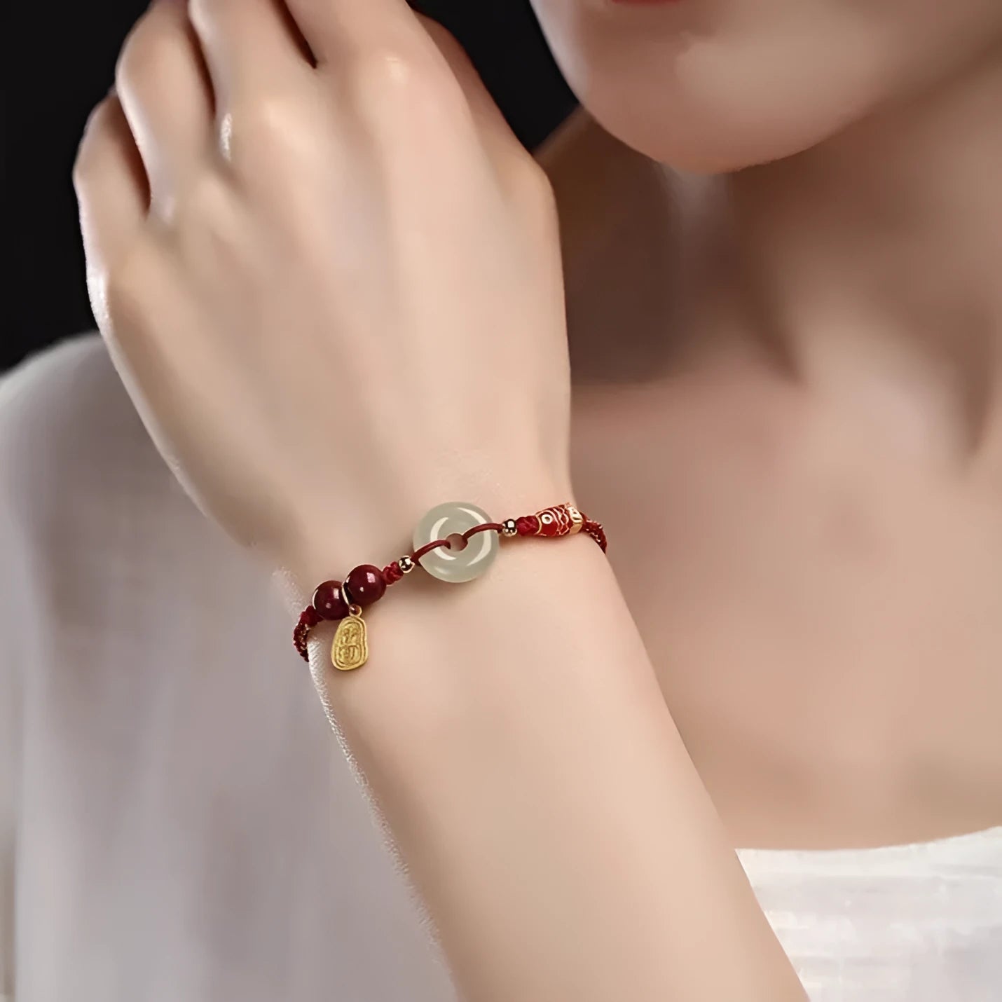 10mm Hetian jade peace buckle bracelet with colourful braided rope on wrist
