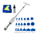 Metal automotive dent repair tool with T-hammer and blue adhesive pieces on a car body panel