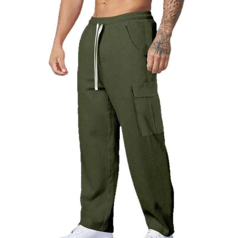 Men's loose-fitting corduroy cargo trousers in navy blue with a drawstring waist and wide straight legs