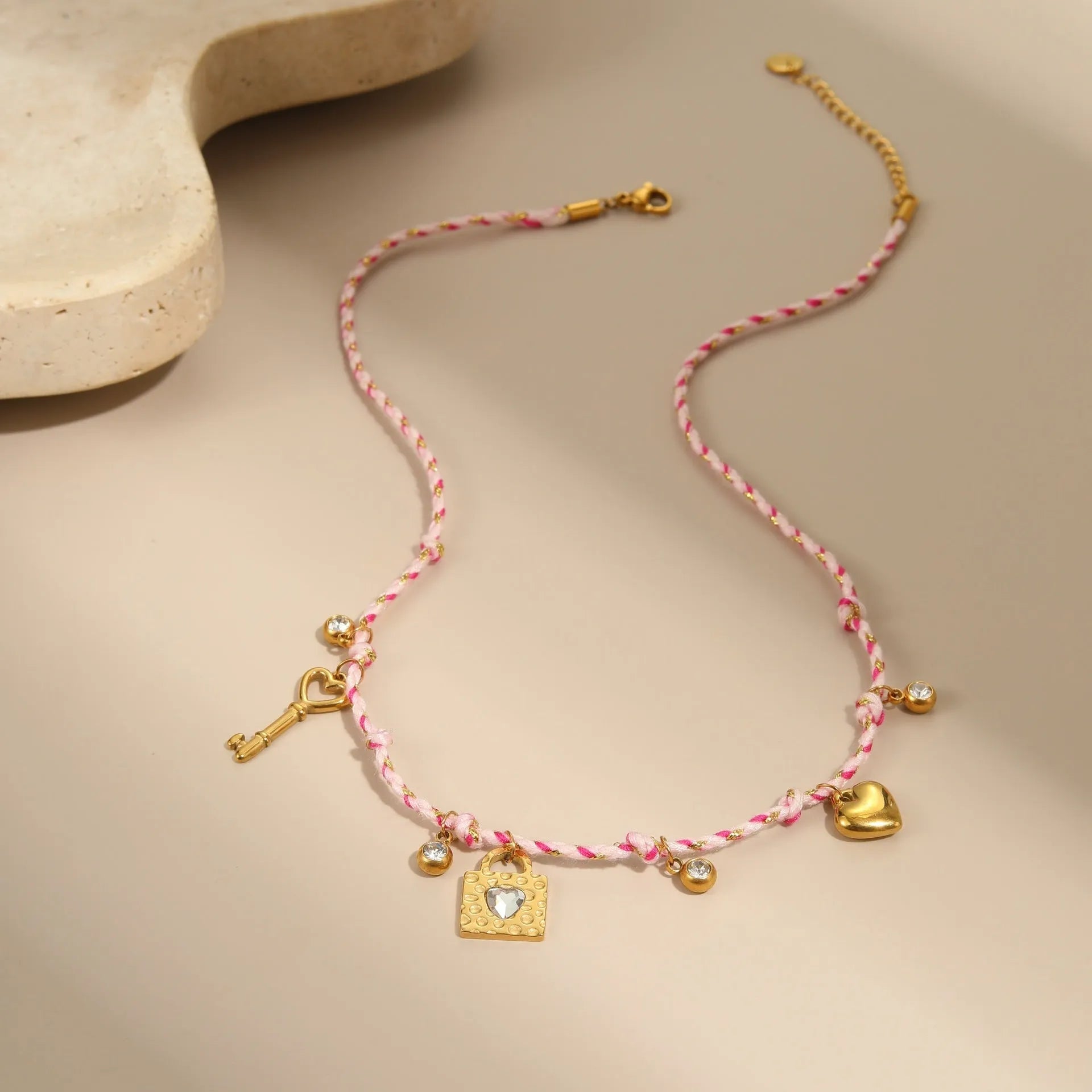 Handmade braided rope titanium steel necklace or bracelet with 18K gold electroplating in purple, pink, or blue styles.